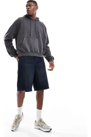 ASOS Pantalones cortos vaqueros de corte alargado con lavado azul medio de