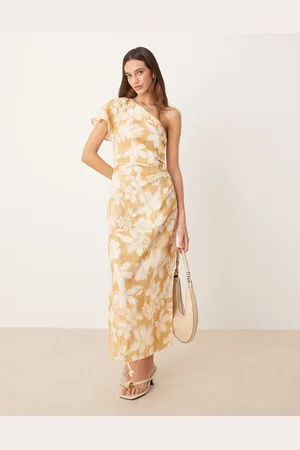 MANGO Vestido semilargo color amarillo pastel asimétrico con estampado floral de