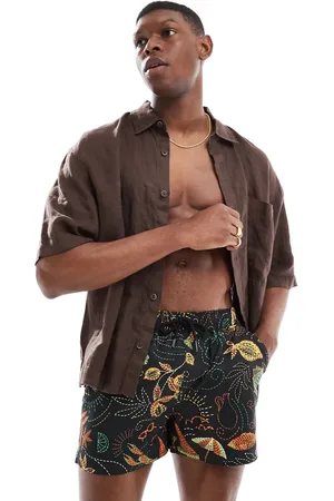 Native Youth Shorts de baño negros con estampado integral de pespuntes de