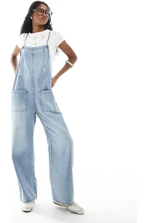 Monki Peto vaquero con lavado y detalle de lazada de
