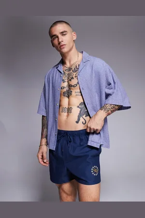 ASOS Shorts de baño cortos con estampado posicional de