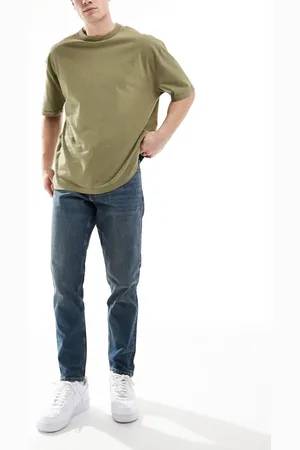 ASOS Vaqueros tapered azules con lavado oscuro de corte elástico de