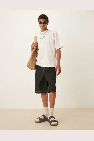 ASOS Pantalones cortos negros holgados de corte alargado extragrande con pinzas de