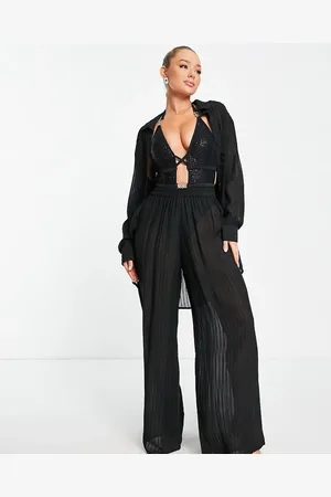 Esmée Pantalones de playa negros a rayas transparentes exclusivos de Esmee