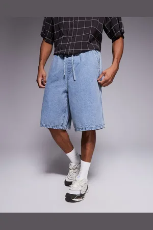 ASOS Pantalones cortos vaqueros de corte alargado sin cierres con franja lateral y de