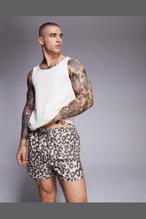 ASOS Shorts de baño cortos con estampado de leopardo de