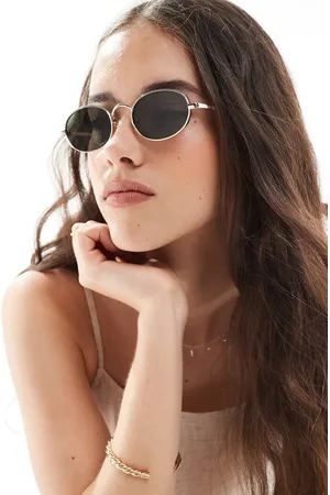 Aire Gafas de sol doradas con montura redondeada de metal y lentes verdes Regulus de
