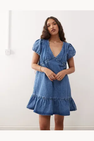 Reclaimed Vestido corto vaquero de corte amplio con mangas abullonadas y lavado medio de