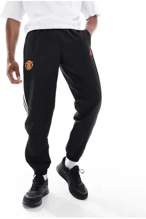 adidas Pantalones de chándal negros con diseño del Manchester United Urban Purist de adidas Football