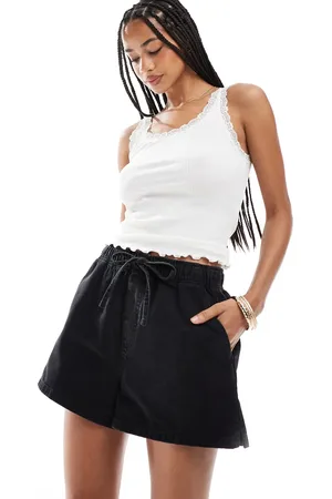 ASOS Pantalones cortos vaqueros sin cierres con lavado de