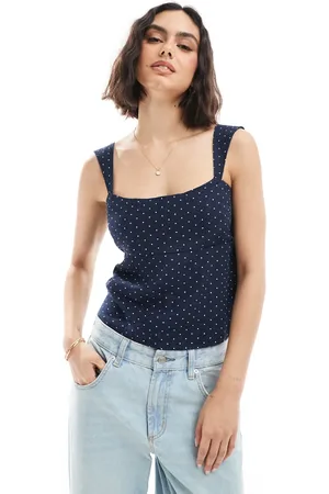 Hollister Top azul marino sin mangas con estampado de lunares y lazada en la espalda de lino de
