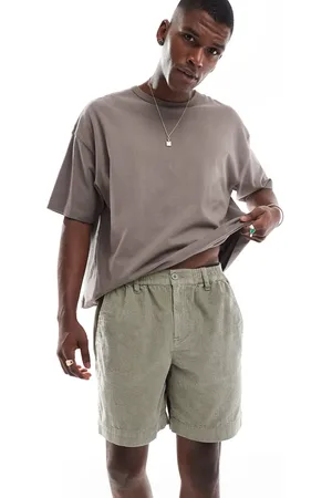 ASOS Pantalones cortos caquis de corte alargado y estilo worker de pana de -Verde