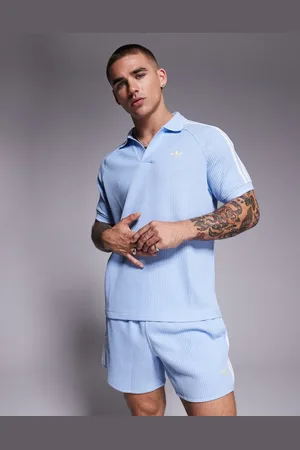 adidas Polo azul de punto gofrado de