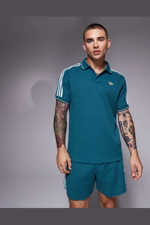 adidas Polo de punto gofrado de