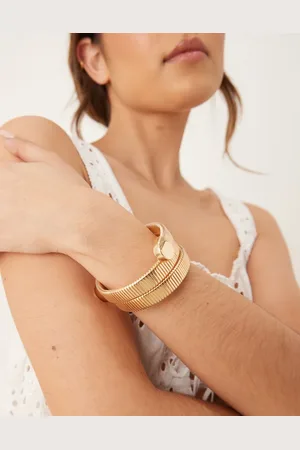 Accessorize Pulsera rígida dorada con diseño envolvente de