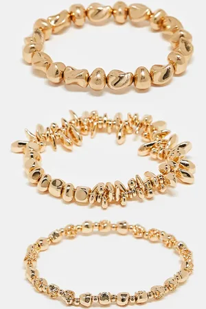 Accessorize Pack de 3 pulseras doradas elásticas sin cierres con diseño de coral de