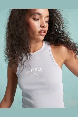 Miss Selfridge Top azul lavado sin mangas con cuello de nadadora y estampado "Los Angeles" de canalé de
