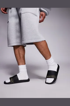 EA7 Sandalias playeras negras con logo dorado de Armani -Negro