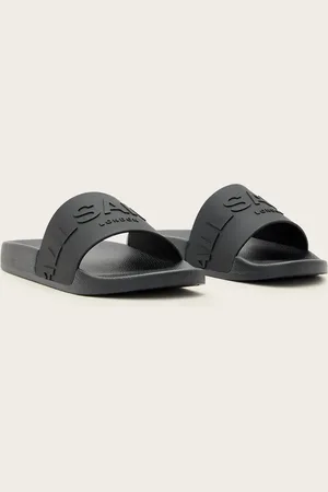 AllSaints Sandalias negras de goma con logo a tono Biggy de
