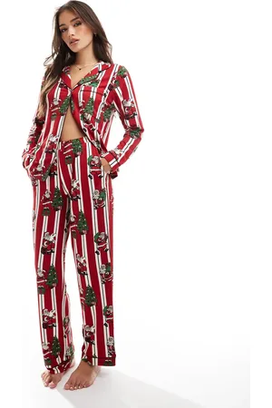 Chelsea Peers Pijama de top de manga larga con cuello de solapas y pantalones a rayas con estampado navideño de Papá Noel de poliéster His & Hers de
