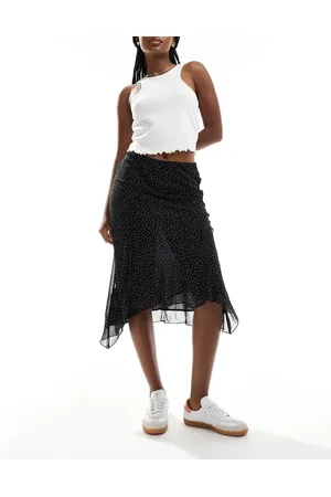MANGO Falda midi negra con estampado de lunares y bajo asimétrico de