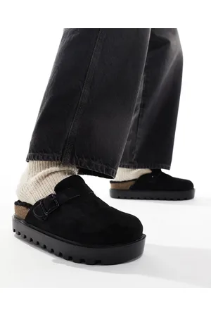 ASOS Zuecos negros estilo mules con forro de piel sintética de
