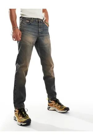 ASOS Vaqueros de corte tapered con lavado azul tintado de