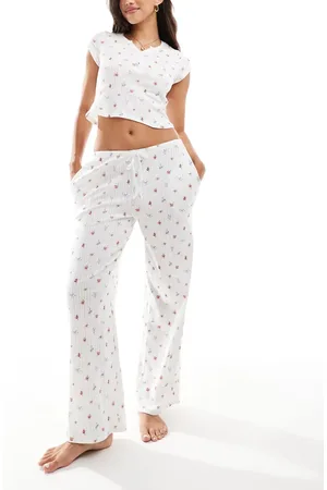 Kaiia Pantalones de pijama color crema de pernera ancha con estampado de florecitas de punto pointelle Mix & Match de -Multicolor