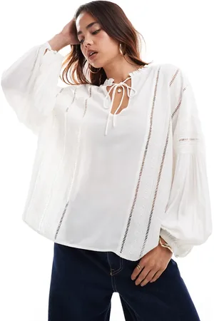 & OTHER STORIES Blusa con diseño voluminoso, bordados y lazada en el cuello de