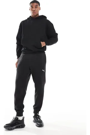 PUMA Joggers negros con logo Essentials de