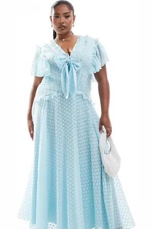 ASOS Vestido midi con mangas fluidas, patrón de lunares de jacquard devoré con lazada delantera de ASOS DESIGN Curve