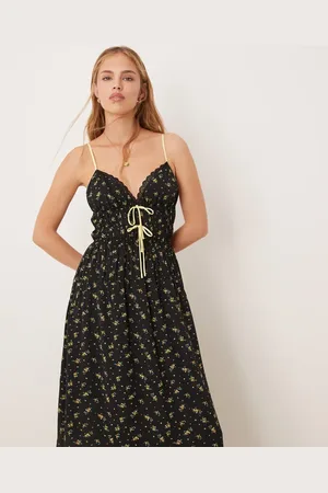 Kiss The Sky Vestido largo negro sin mangas con estampado floral y cuello de pico de