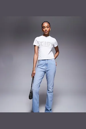 ASOS Vaqueros de campana de talle medio con lavado tenue de ASOS DESIGN Tall-Azul
