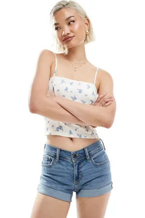 Hollister Pantalones cortos vaqueros de talle bajo con lavado vintage y bajos vueltos en contraste de