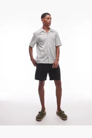 ARKET Pantalones cortos negros lisos con bolsillos delanteros oblicuos de lino de