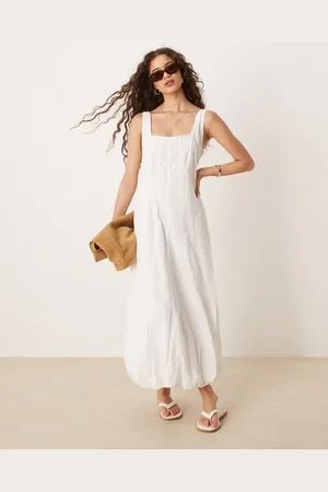 MANGO Vestido semilargo estructurado con bajo abullonado de algodón suave de
