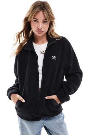 adidas Chaqueta negra con cremallera de tejido efecto peluche de