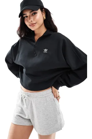 adidas Sudadera negra con media cremallera Essentials de