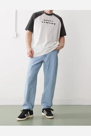 A Bathing Ape Vaqueros de corte suelto con lavado claro de