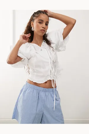 Reclaimed Top de estilo wéstern con mangas abullonadas y lazada delantera de