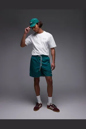 Parlez Pantalones cortos verdes holgados con detalle del logo Enigma de