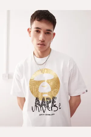 A Bathing Ape Camiseta blanca con logo con fondo de camuflaje de