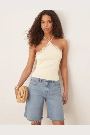 ASOS Top amarillo tenue ceñido con cuello halter y ribete de encaje de