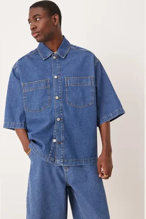 ASOS Camisa vaquera extragrande de manga corta con lavado azul medio y bolsillos de parche de (parte de un conjunto)