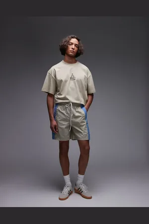 Parlez Pantalones cortos beis holgados con panel azul en contraste Copa de