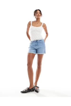 ONLY Pantalones cortos vaqueros elásticos con lavado azul claro y bajos vueltos de