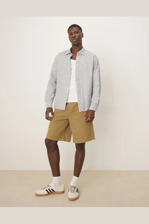 ASOS Pantalones cortos oliva de corte alargado de