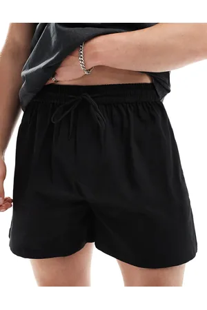 COLLUSION Pantalones cortos playeros negros de tejido liso de