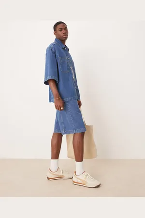 ASOS Pantalones cortos vaqueros de corte alargado con lavado azul medio y detalle de costuras de (parte de un conjunto)