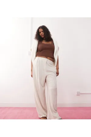 COLLUSION Pantalones color holgados de tejido liso de Plus-Neutro